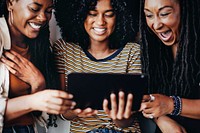 Girls watching an online video clip on a digital tablet