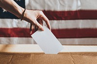 American casting her vote to a ballot box mockup