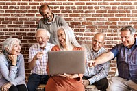 Cheerful elderly people surfing the internet