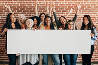 Group of diverse women showing a blank banner mockup