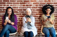 Diverse women concentrating on their phones