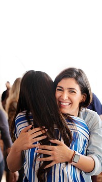 Woman embracing her friend in a workshop