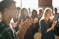 Diverse people clapping after a session