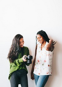Happy women with a digital camera talking social template