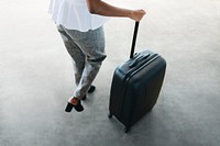 Woman and her luggage getting ready for a trip