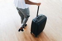 Woman and her luggage getting ready for a trip