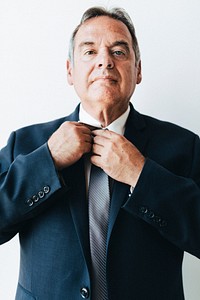 Portrait of an aged manager in a blue suit