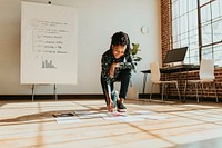 Businesswoman planning a marketing strategy on a wooden floor