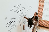 Business people writing on a whiteboard mockup