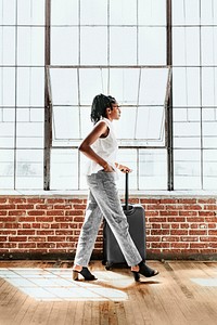 Woman and her luggage getting ready for a trip