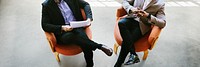 Businessmen talking and sitting on chairs social banner