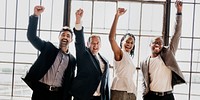 Diverse business team raising hands up in the air social banner