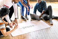 Diverse people brainstorming in a workshop on a paper mockup