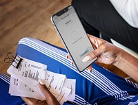Woman paying bills online via internet banking