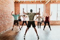 Trainer and his students stretching in a studio