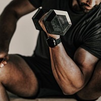 Muscular man weightlifting with a dumbbell