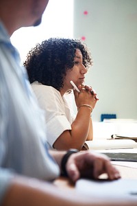 Student with her notebook listening in class