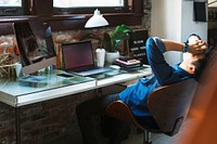 Stressful and exhausted businessman sitting by a computer