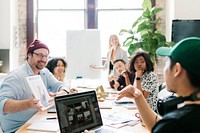 Creative people working on magazine cover design