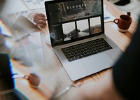 Freelance blogger working on laptop screen