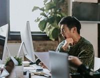 Sleepy businessman yawning in the office