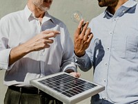 Eco-friendly engineering team with the solar panel