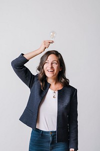 Woman holding a light bulb