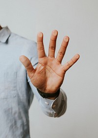 Man pressing his palm to a screen
