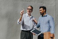 Eco-friendly engineering team with the solar panel