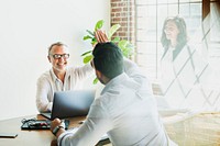 Cheerful eco-friendly engineering team in a meeting