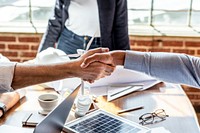 Business people greeting by shake hands