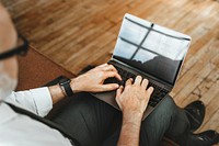 Businessman typing on his laptop