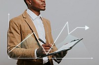 Businessman writing a note on a notebook