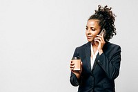 Professional woman with a coffee and a smartphone