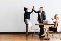 Business people doing a high five