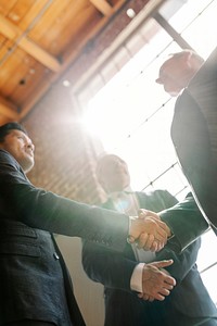 Businessmen greeting by a handshake