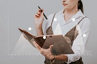 Businesswoman holding a personal notebook and a pen
