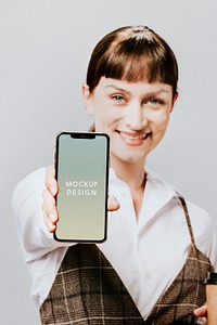 Happy woman displaying a mobile phone mockup