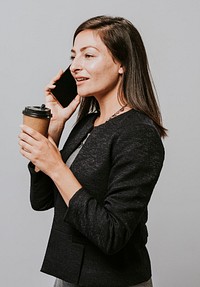 Professional woman with a coffee and a smartphone