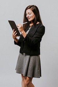 Happy businesswoman using a digital tablet