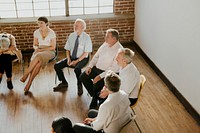 People sitting and talking with a group