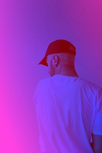 Rearview of man in a cap with pink and blue filter effect