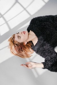 Brown hair woman in a black fluffy sweater