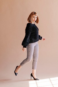 Woman in a fluffy sweater posing