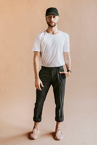 Bearded man in a white t-shirt and black pants