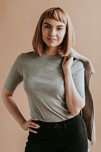 Short brown hair woman in a gray tee and black pants