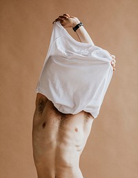Man taking off his shirt