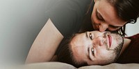 Couple kissing in the bed