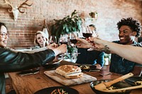 Friends making a toast at a dinner party