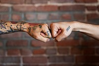 Friends giving each other a fist bump